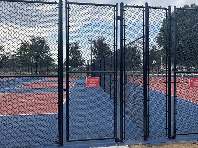 Black chain link pickleball court fence in Tontitown, Arkansas — Thomas Fence