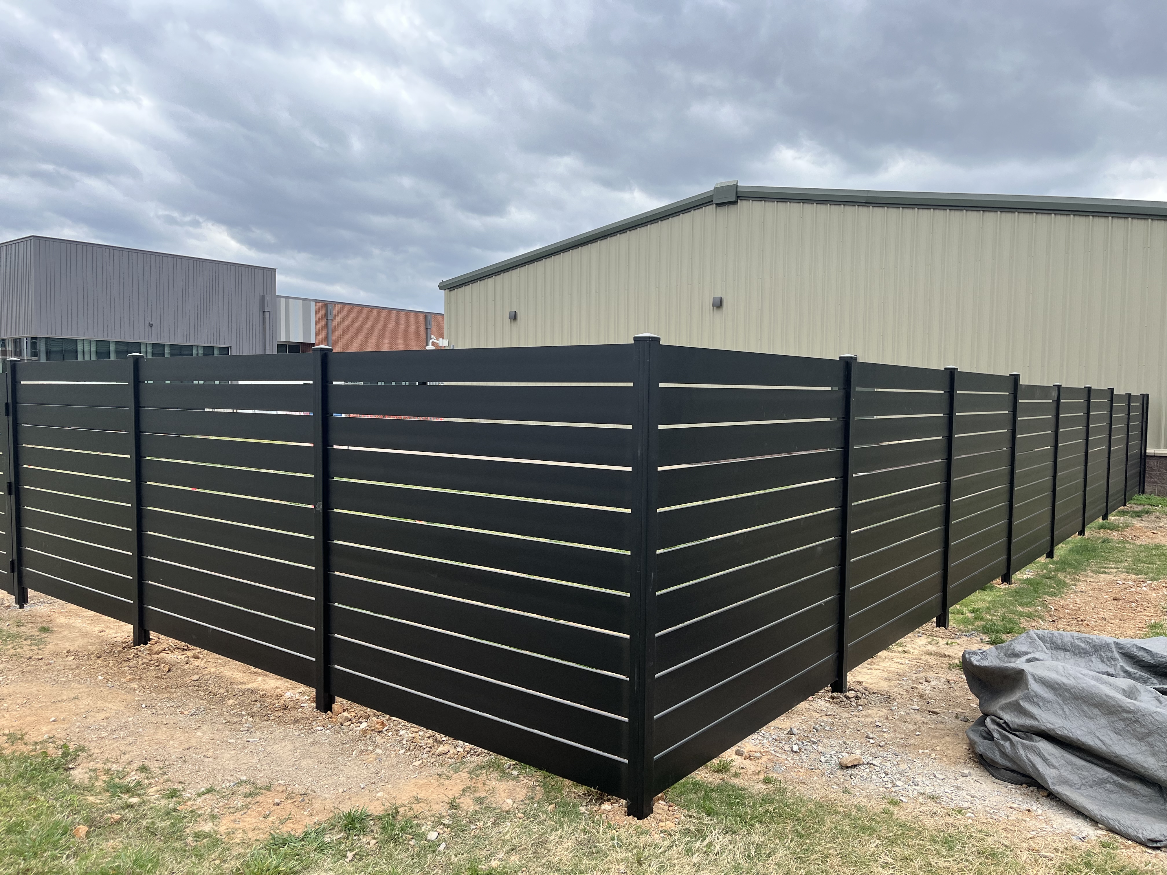 Commercial horizontal fence installation — Thomas Fence, Bentonville, Arkansas