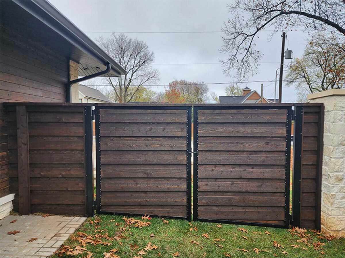 Horizontal wood fence installed by Thomas Fence at a residential property in Bentonville, Arkansas
