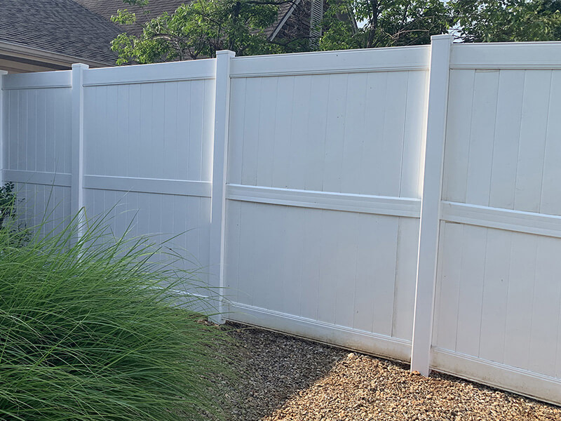 Vinyl perimeter fence installed by Thomas Fence in Fayetteville, Arkansas