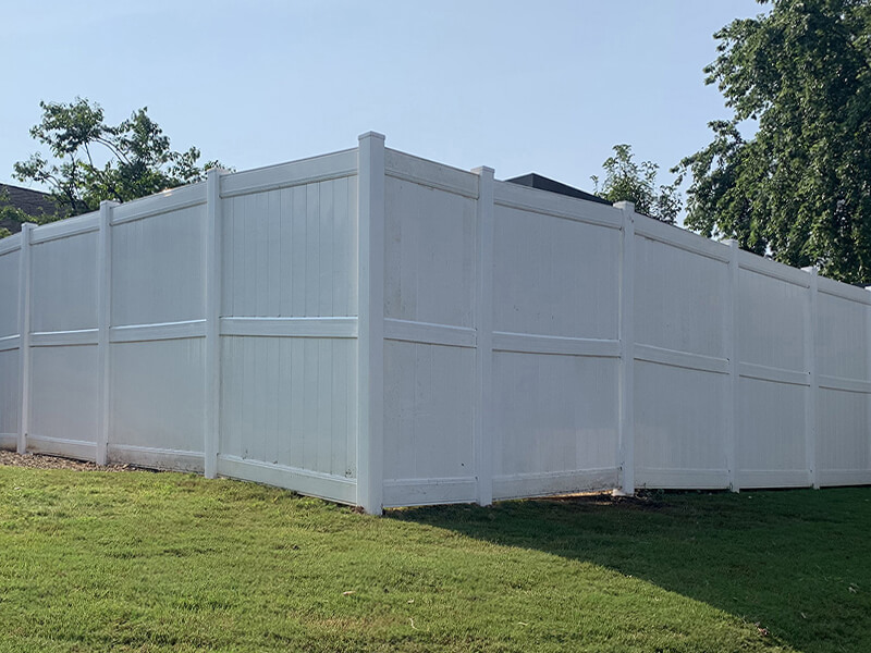 Commercial vinyl perimeter fence installed by Thomas Fence in Fayetteville, Arkansas