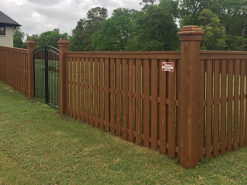 Wood privacy fence installed by Thomas Fence at a residential property in Bentonville, Arkansas