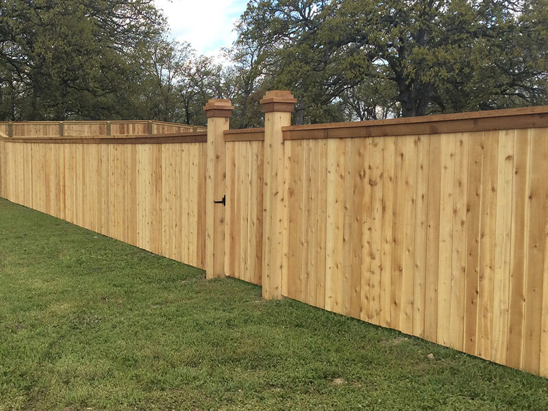 Cedar cap-and-trim wood fence — Thomas Fence, Siloam Springs, Arkansas